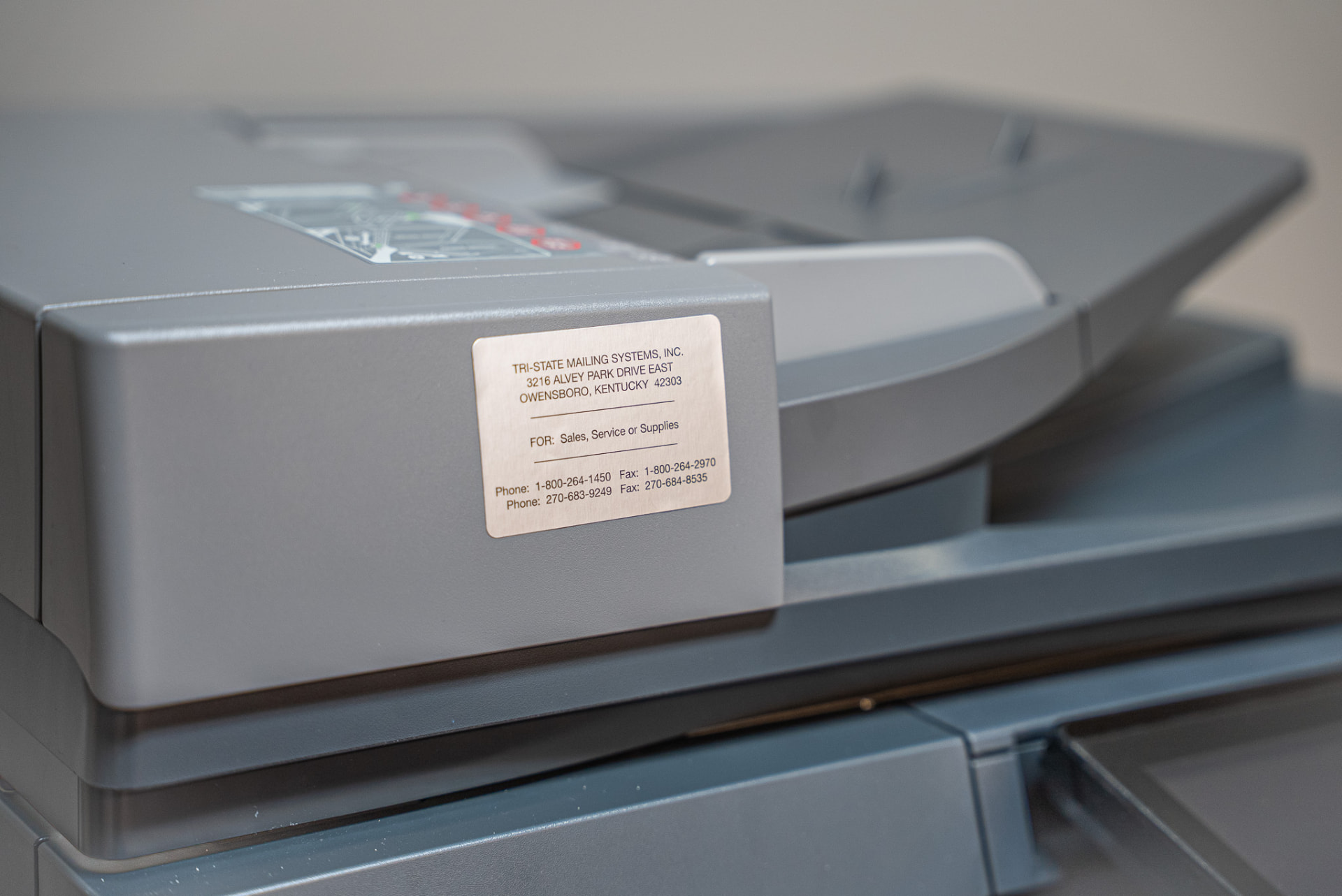 Tri-State sales, service and supplies label on a Sharp copier